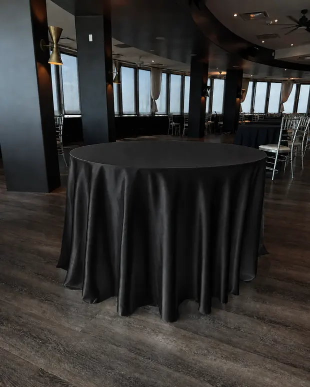 Black 120-inch round tablecloth set for six at Founders Tower, Oklahoma City